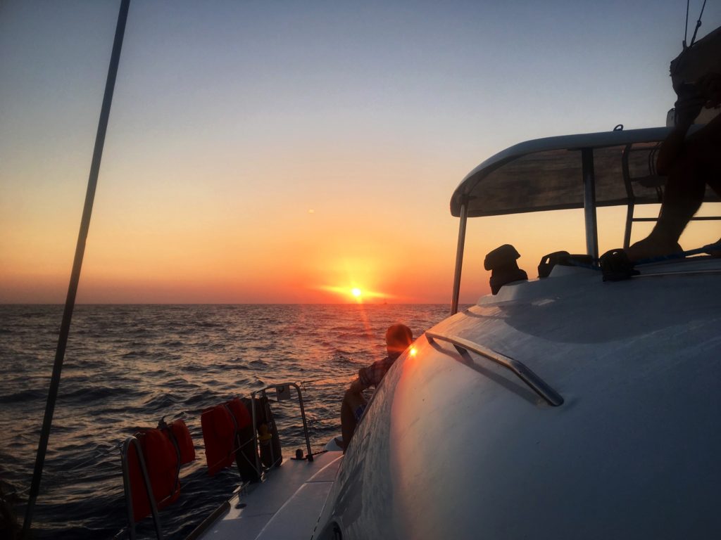 santorini sunset; sunset cruise; catamaran cruise; catamaran sunset; santorini sunset cruise; greek sunset; sunset over the water