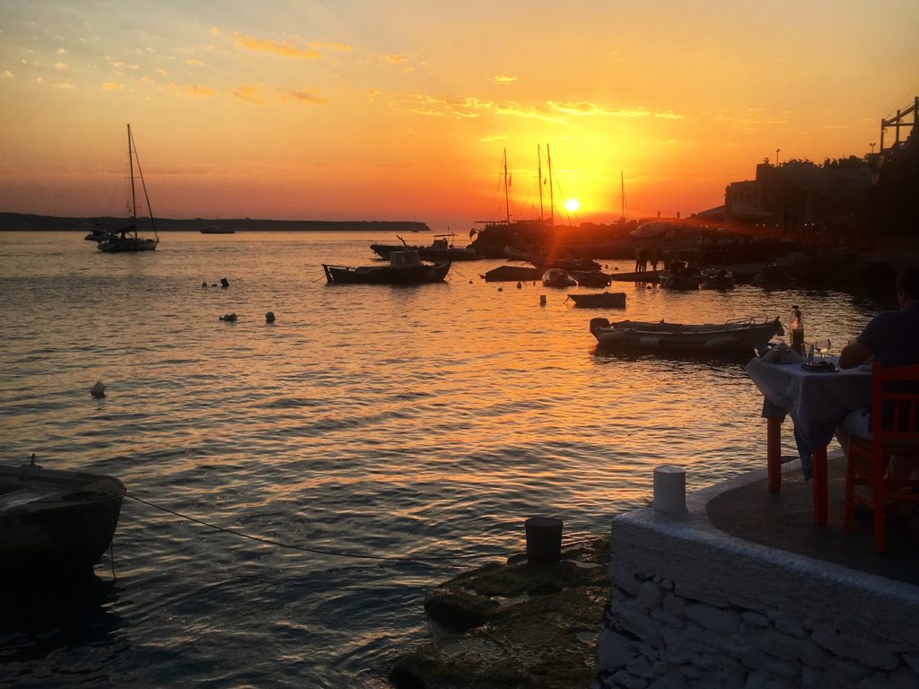 santorini sunset; ammoudi bay; ammoundi bay sunset; oia sunset; greek sunset; sunset over the water